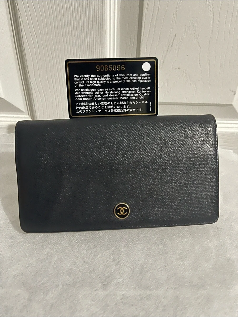 CHANEL Black Leather Clutch with Gold CC Emblem(comes with box and dust cloth)